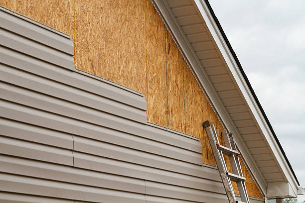Professional Storm Damage Siding Repair technician working in Moravian Falls, NC